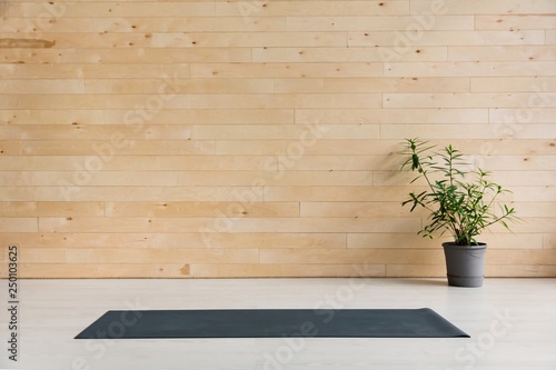 Empty yoga mat on the floor. Equipment for yoga. Concept healthy lifestyle