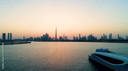 Aerial view of a yacht in the bay of Dubai during sunset, U.A.E.