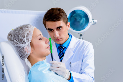 Plastic surgery doctor, patient inspection and consultation photo