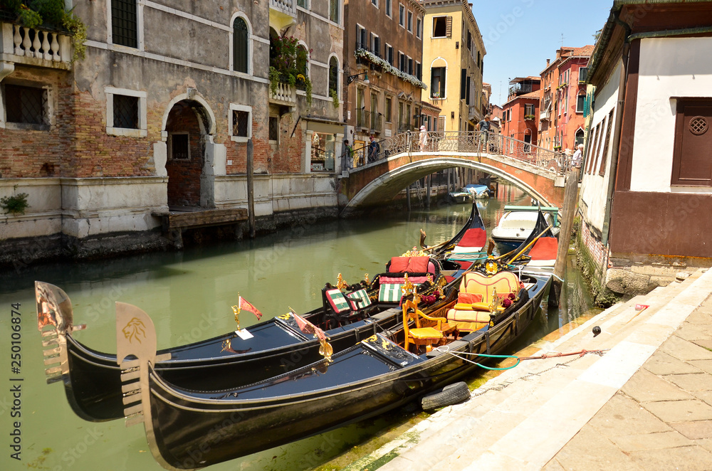 Gondola service tourist people travel around Venice in Italy. Gondolas in Venice.