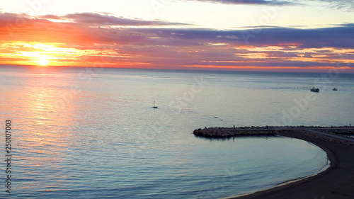 Sunset over the mediterraneanSea at Fuengirola on the Costa del Sol in Spain photo
