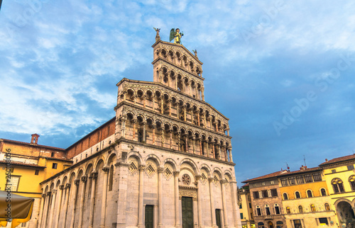 Facade of Chiesa di San Michele in Foro St Michael Roman Catholic church basilica on Piazza San Michele square in historical centre of old medieval town Lucca, evening view, Tuscany, Italy