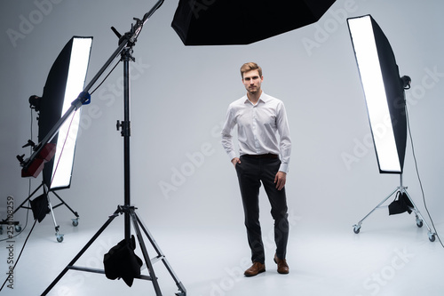 backstage self-confident man equipment workplace photo studio concept. Photography of fashion look