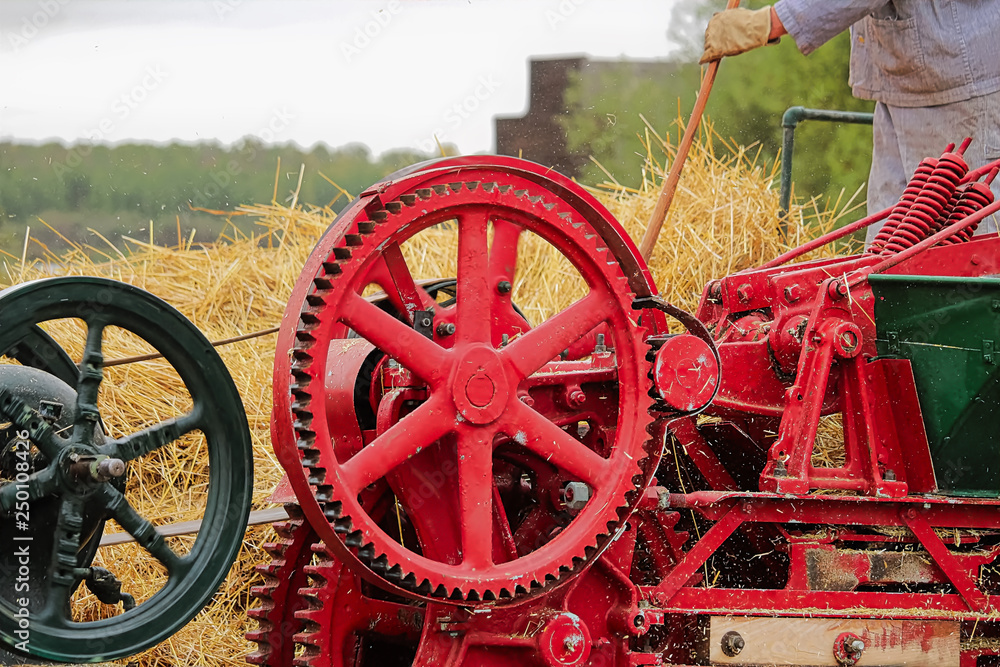 Wheels and gears on an old baling machine