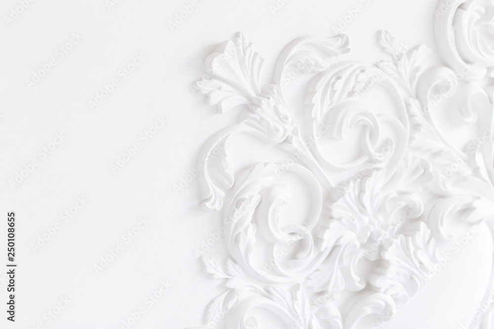 Beautiful ornate white decorative plaster moldings in studio