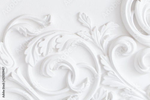 Beautiful ornate white decorative plaster moldings in studio photo