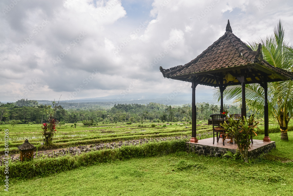 Gazebo with table and chairs by the rice fields