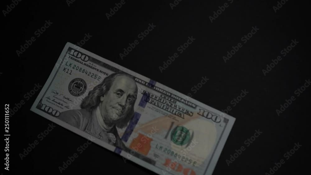 Hundred dollar bill on the black background Hundred dollar bill on the black background