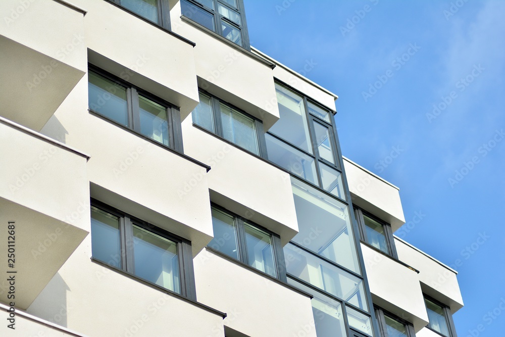 Modern white building with balcony on a blue sky Modern white building with balcony on a blue sky