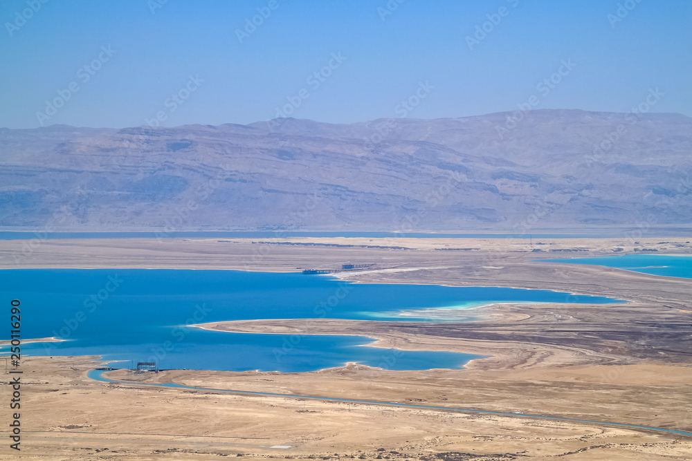 Stunning view of salt deposits and turquoise water of the Dead Sea and Judean Desert in Israel