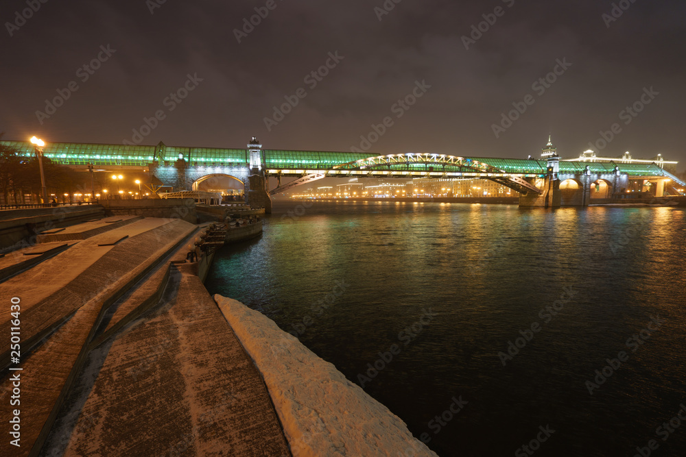 Park Gorkogo in Moscow (Gorky park) at night winter time. Andreevsky pedestrian bridge image. Park Gorkogo in Moscow (Gorky park) at night winter time. Andreevsky pedestrian bridge image.