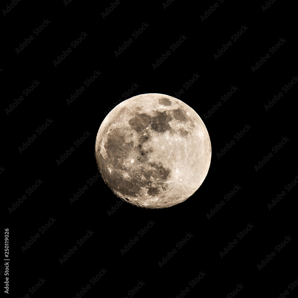 Fototapeta premium Full moon on the black winter sky background.