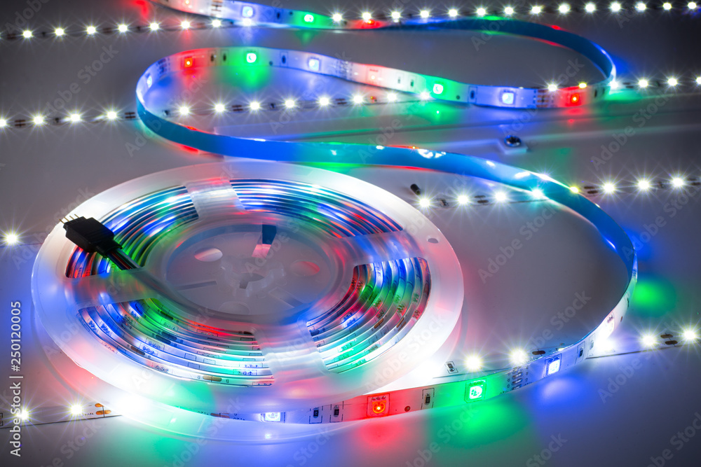 Obraz premium RGB LED light strip on white table plate background