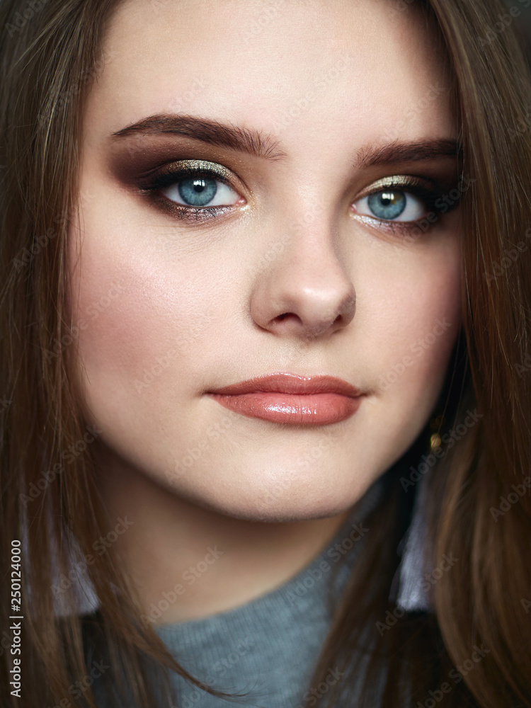 Young beautiful woman with professional make up and hairstyle Young beautiful woman with professional make up and hairstyle