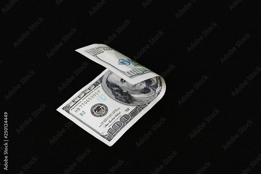 100 USD banknote, black background
