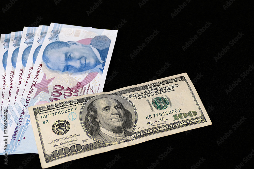 100 Turkish Lira and 100 USD banknote, black background, side by side, 100 Turkish Lira and 100 USD banknote, black background, side by side,