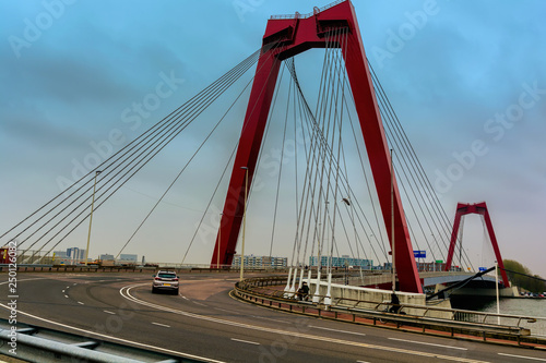 ROTTERDAM, NETHERLANDS - APRIL 13, 2018: The Willemsbrug is a bridge next to the Erasmusbrug in the centre of Rotterdam, spanning the Nieuwe Maas.