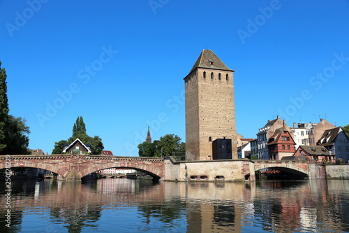 Old bridge and towers  in the "Petite France" historical district of Strasbourg - France