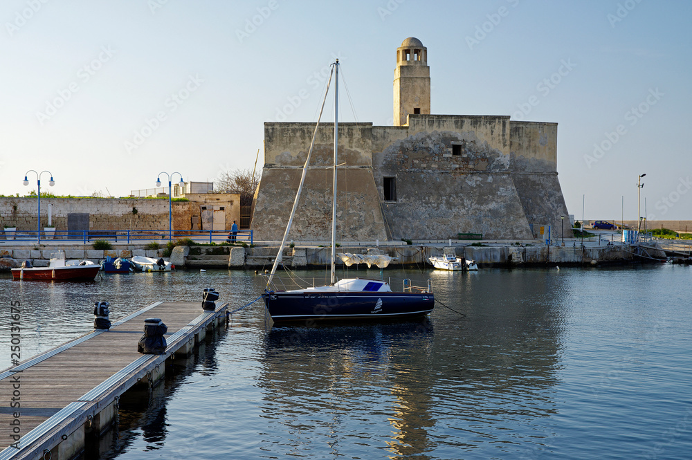 VILLANOVA, APULIA, ITALY - MARCH 28th, 2018: The small port with Medieval Castle on the sea edge at Villanova, Puglia, Italy
