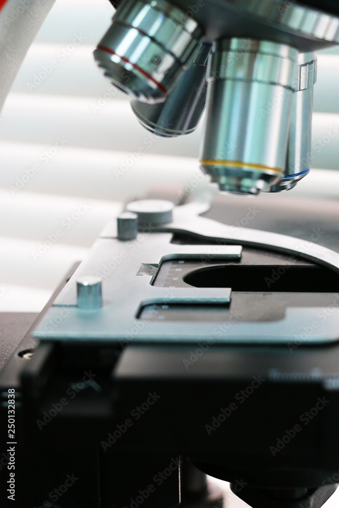 Close up of microscope at the blood laboratory, Concept Science and Technology Close up of microscope at the blood laboratory, Concept Science and Technology
