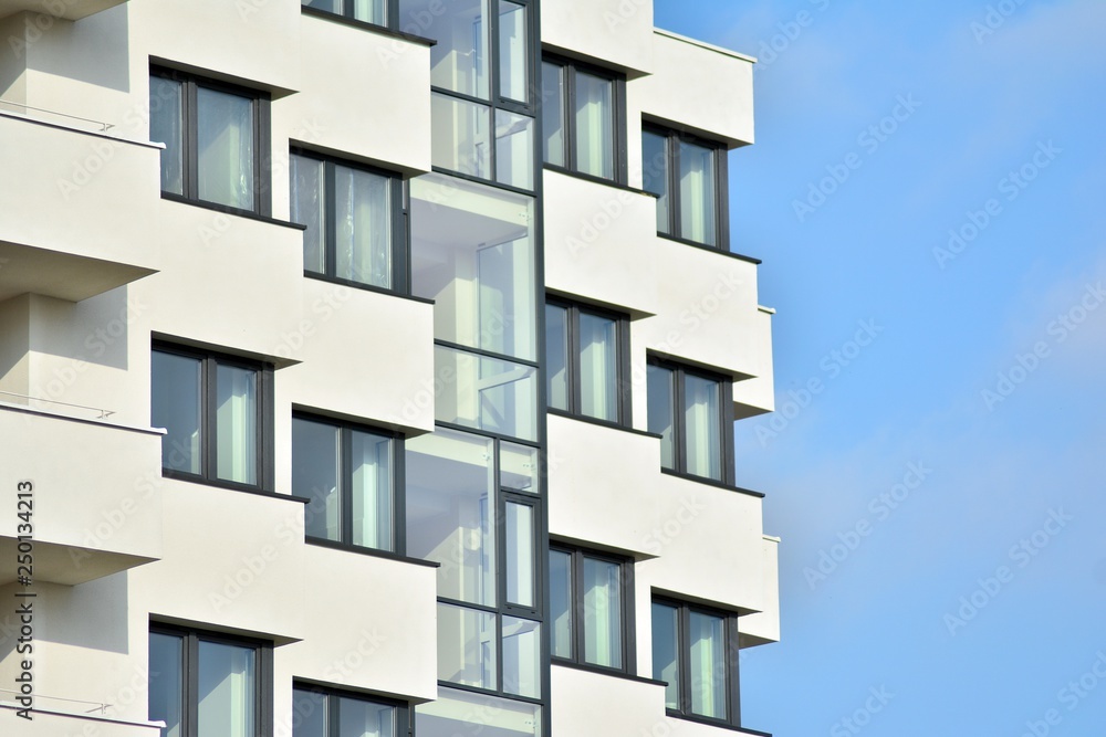 Modern white building with balcony on a blue sky Modern white building with balcony on a blue sky