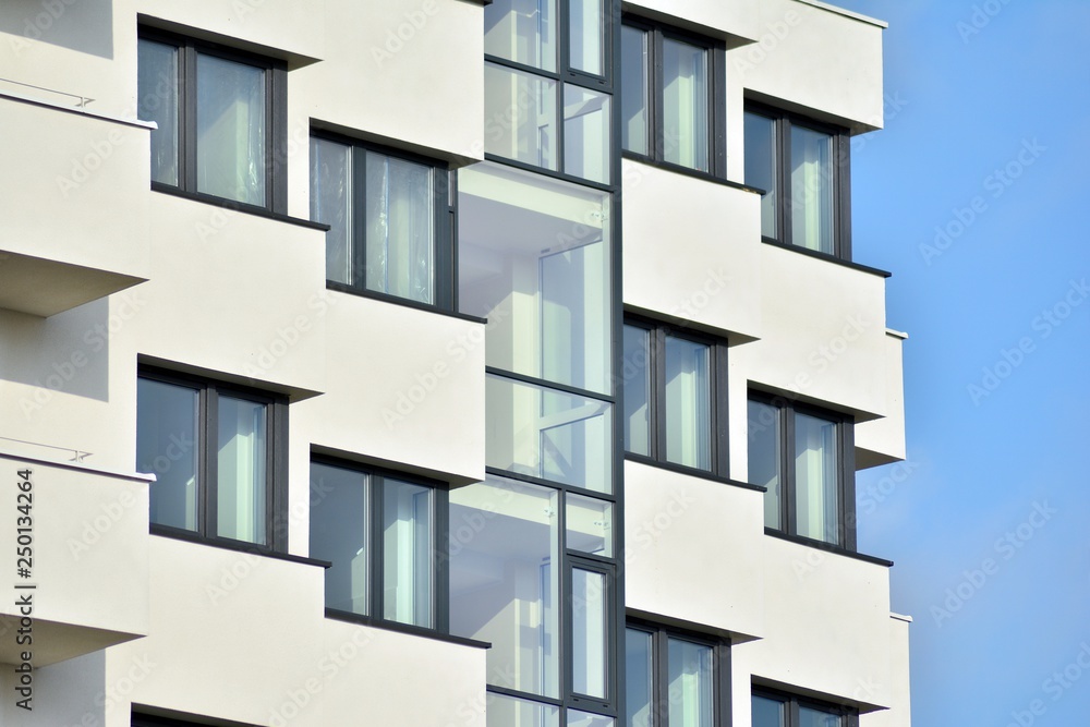 Modern white building with balcony on a blue sky Modern white building with balcony on a blue sky