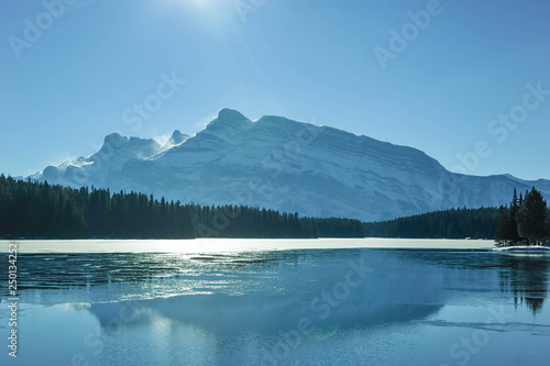 Johnson Lake freezing over by Mount Rundle in Alberta © LaurieSH