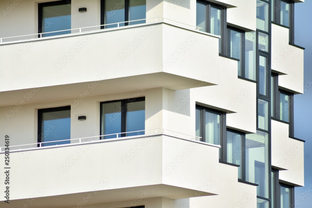 Modern white building with balcony on a blue sky Modern white building with balcony on a blue sky