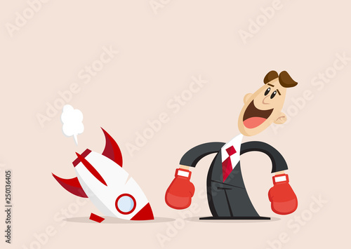 Happy Businessman with boxing gloves stands next to broken rocket
