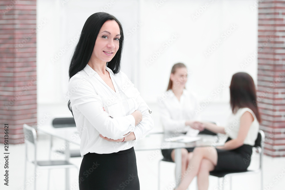 portrait of confident business woman on blurred office background portrait of confident business woman on blurred office background
