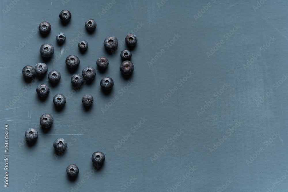 Blueberries background. Blueberry border design. Ripe and juicy fresh picked bilberries close up. Copyspace for your text Blueberries background. Blueberry border design. Ripe and juicy fresh picked bilberries close up. Copyspace for your text