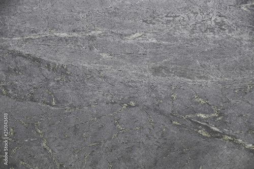 Closeup black soapstone with natural pattern texture background.