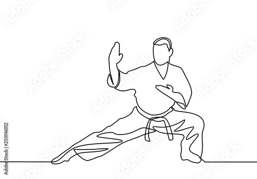 continuous line drawing of one male karate athlete - Vector
