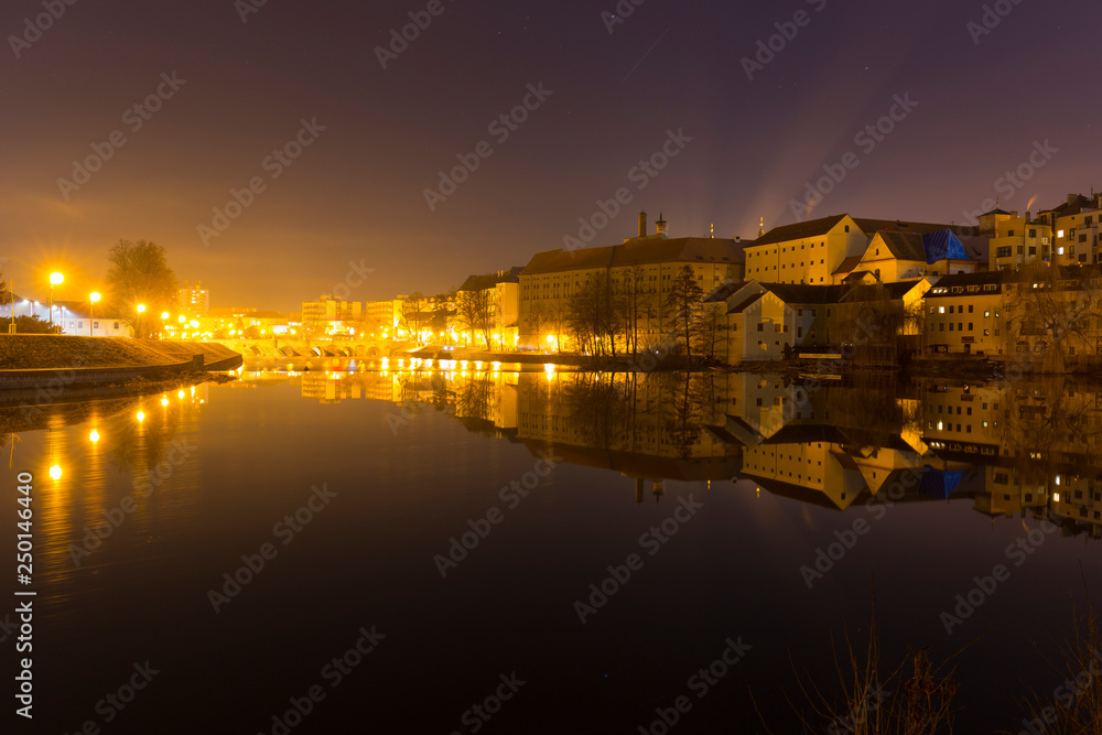 Night winter royal medieval Town Pisek above the river Otava, Czech Republic 