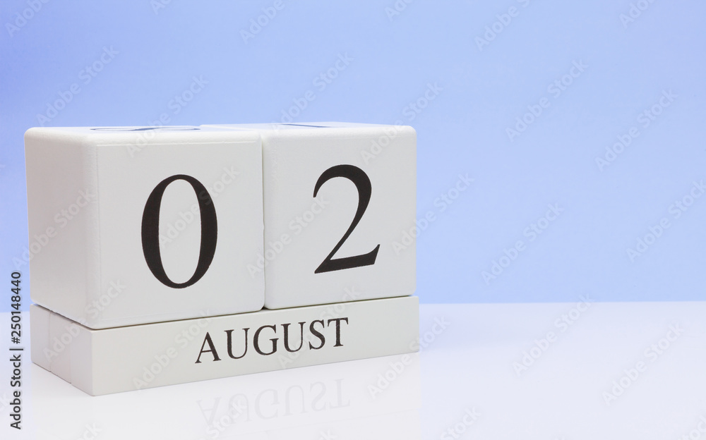 August 02st. Day 2 of month, daily calendar on white table with reflection, with light blue background. Summer time, empty space for text August 02st. Day 2 of month, daily calendar on white table with reflection, with light blue background. Summer time, empty space for text