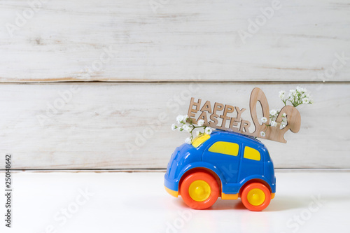 Easter cars with the words  ''Happy Easter'' on a white background, the concept of the approaching easter