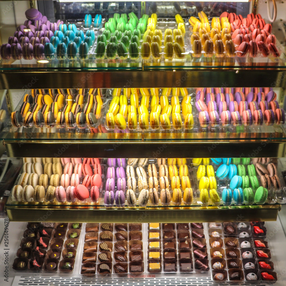 An assortment of colorful macaroons and chocolates.