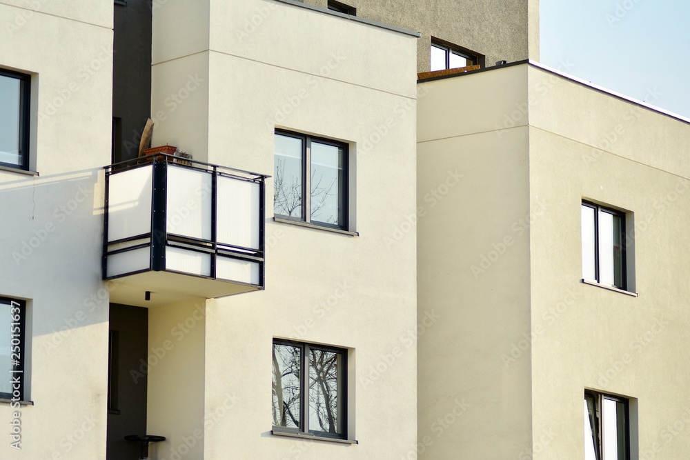 Modern white building with balcony on a blue sky Modern white building with balcony on a blue sky