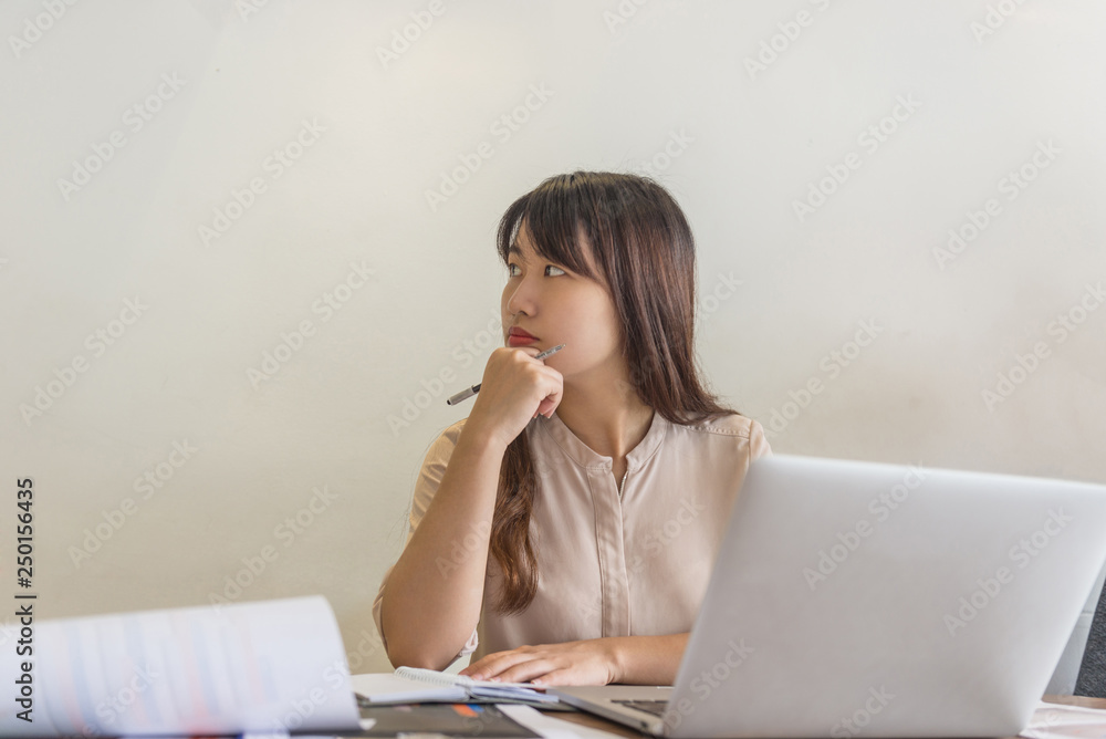 Woman employee thinking about new ideas for work Woman employee thinking about new ideas for work