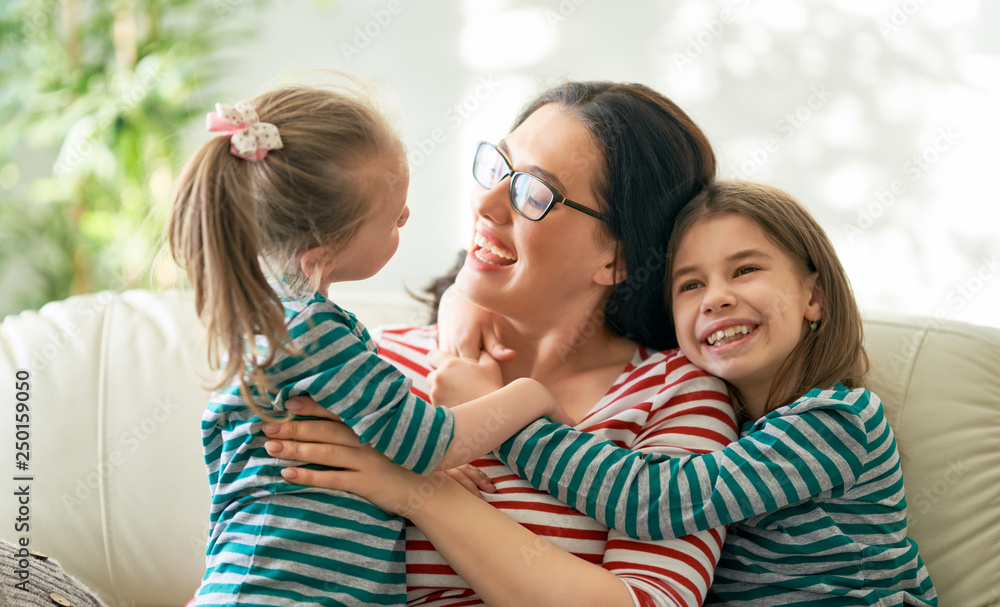 Obraz premium mother and daughters playing