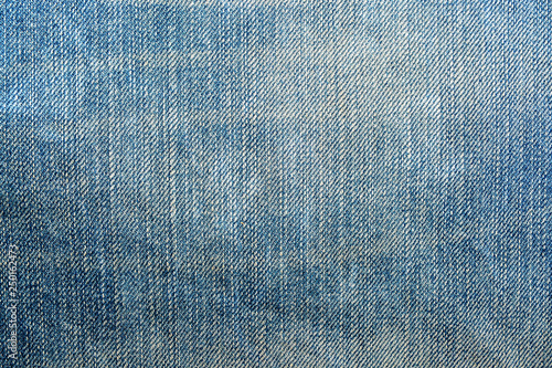 Shabby denim texture for background. Blue jeans 
