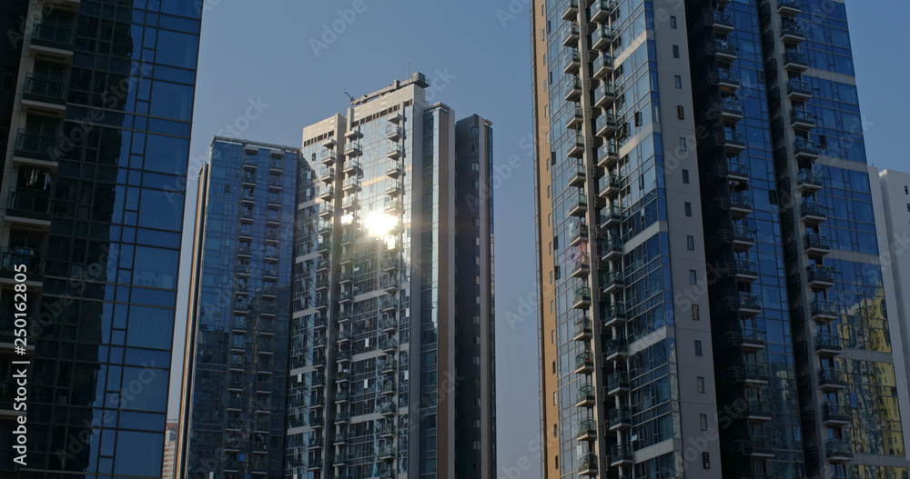 Glass of building with sunlight flare