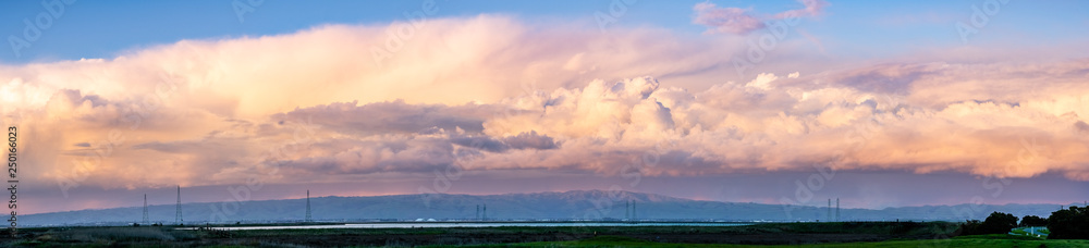 Colorful sunset over the marshes and mountains of south San Francisco bay area, California