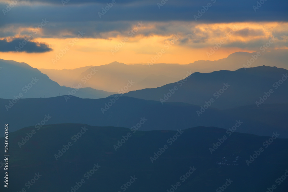 Beautiful landscape of mountain range with sunrise light in dongchuan of China