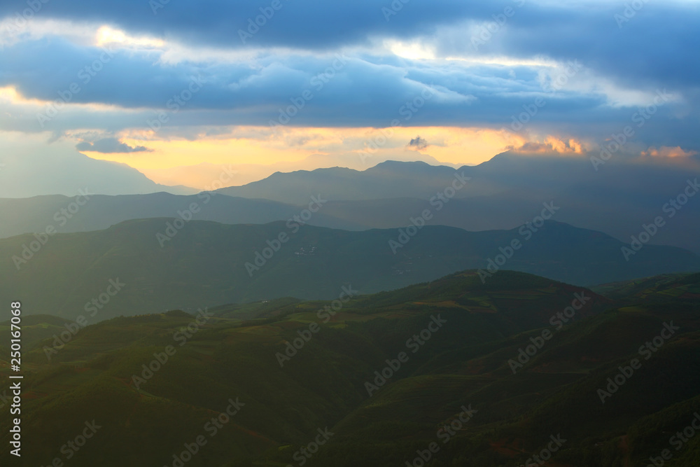 Beautiful landscape of mountain range with sunrise light in dongchuan of China