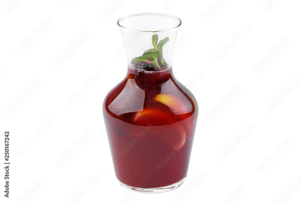 Cocktail in a glass carafe with blackberries and lime and sweet syrup. Soft drink isolated on white background. Cocktail in a glass carafe with blackberries and lime and sweet syrup. Soft drink isolated on white background.