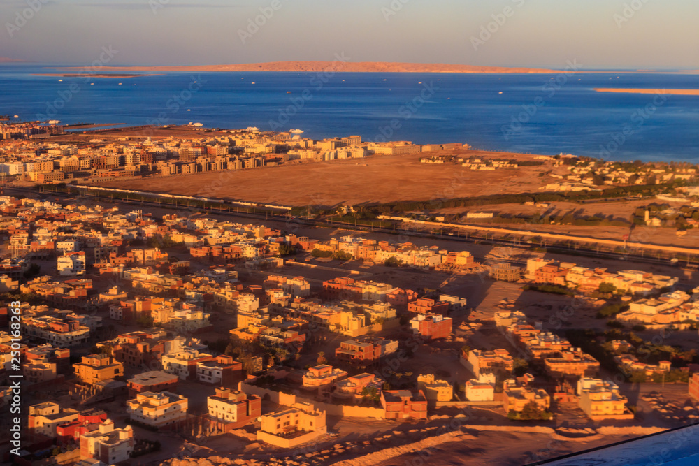 Aerial view on Red sea and Hurghada city, Egypt. View from airplane