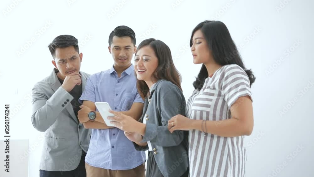 Portrait of young asian business people looking at smartphone Portrait of young asian business people looking at smartphone
