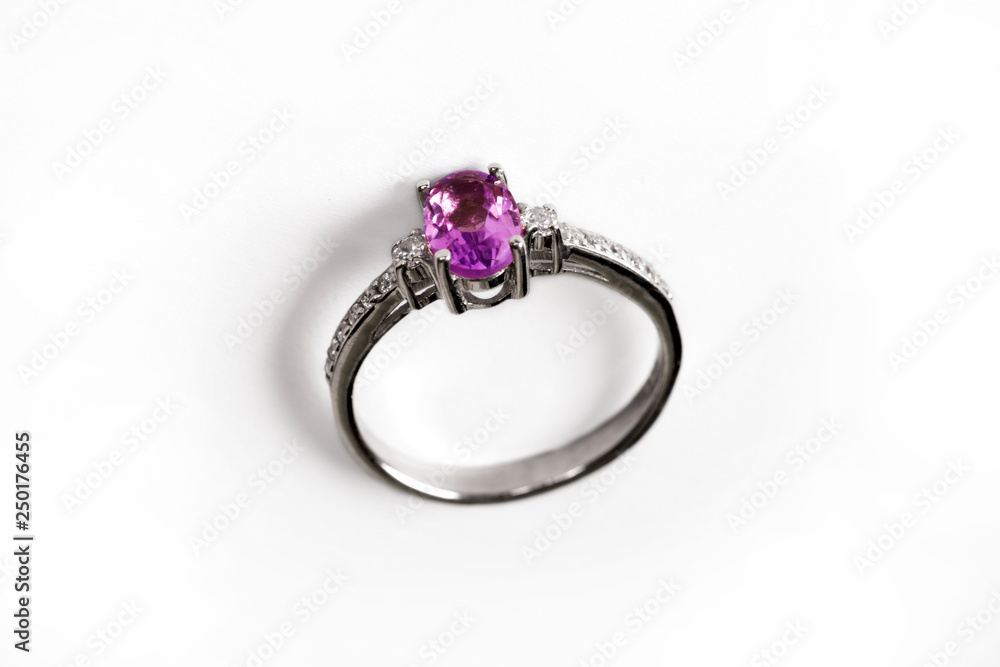 Luxury ring with pink sapphire isolated on white background Luxury ring with pink sapphire isolated on white background