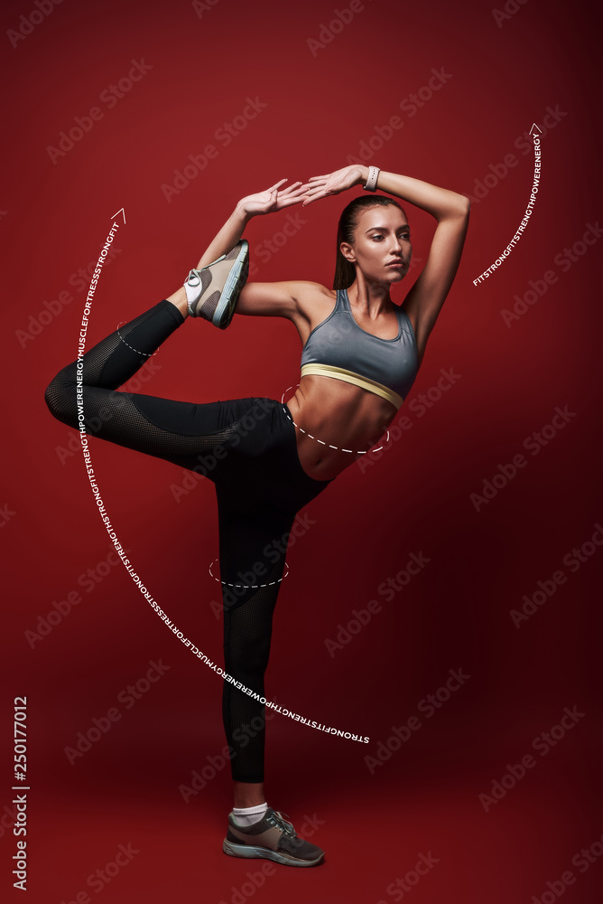The best training program in the world is absolutely worthless without the will to execute it properly, consistently, and with intensity. Sportswoman standing over red background, stretching her body The best training program in the world is absolutely worthless without the will to execute it properly, consistently, and with intensity. Sportswoman standing over red background, stretching her body